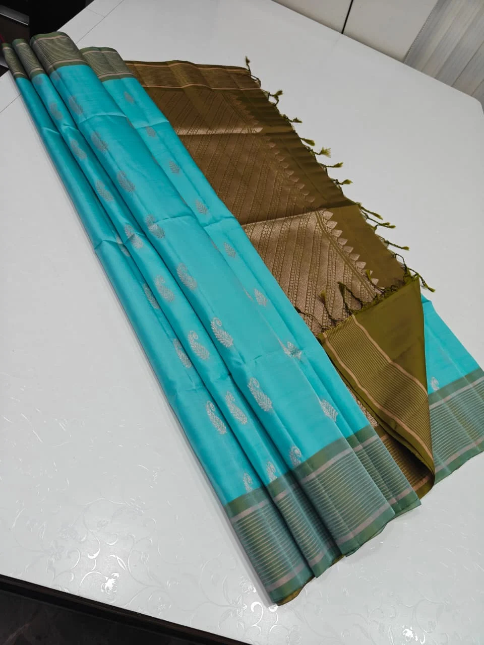 Sky Blue with Olive Green Leaf Paisley Buttas Soft Silk Saree